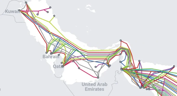 Multi-colored lines running through a map representing the Strait of Hormuz show undersea Internet cable routes.