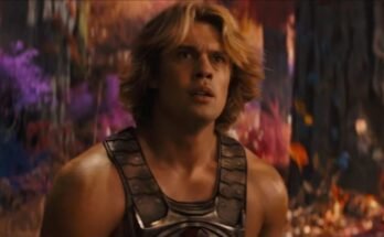 very muscular young man with wave blond hair in a He-Man costume.