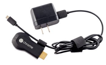 https://arstechnica.com/gadgets/2026/05/original-chromecast-lives-devices-back-on-after-mysteriously-breaking-this-week/1st generation Chromecast HDMI dongle isolated on white background.