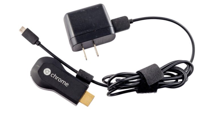 https://arstechnica.com/gadgets/2026/05/original-chromecast-lives-devices-back-on-after-mysteriously-breaking-this-week/1st generation Chromecast HDMI dongle isolated on white background.