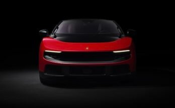 A red Ferrari Luce, head-on