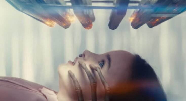 little girl lying on her back in a clinical setting looking up at an array of rods and lights comes down toward her. Spindly alien fingers are touching her face from below.