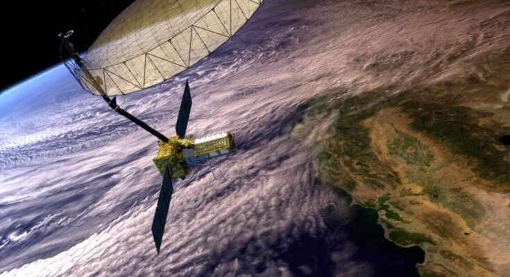 Artist's concept depicts the NASA-ISRO Synthetic Aperture Radar with a main satellite body having two solar panels and a boom attached to the large antenna reflector. The Earth below shows clouds covering the coast of California and the Pacific Ocean.