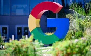 A large Google logo in the shape of a multi-colored G is seen outside Google's Mountain View offices.