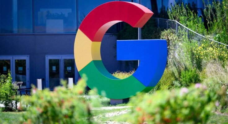 A large Google logo in the shape of a multi-colored G is seen outside Google's Mountain View offices.