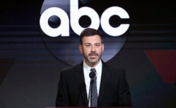 Jimmy Kimmel speaking on stage at an event with an ABC logo in the background.