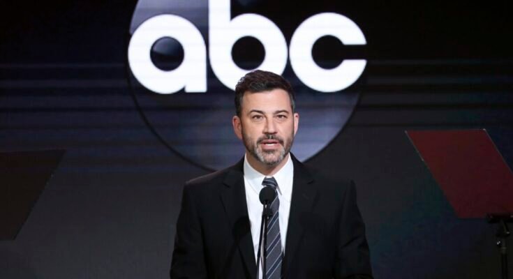 Jimmy Kimmel speaking on stage at an event with an ABC logo in the background.
