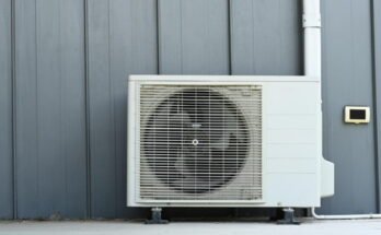 Air conditioner (AC) or heating ventilation air conditioning system (HVAC) beside house.