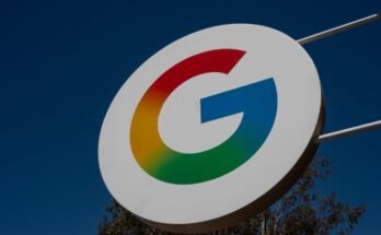 A large sign with Google's "G" logo hangs outside during the daytime.