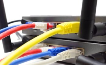 Ethernet cables connected to the ports in a wireless router