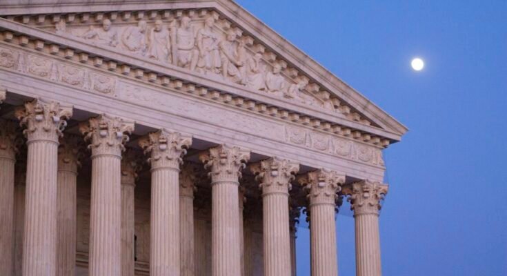 Exterior view of Supreme Court building and its marble columns.
