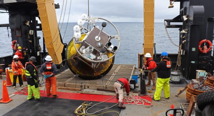 NOAA crew retrieving buoy
