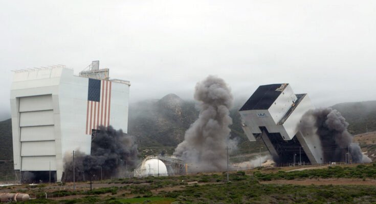 Facilities for launching rockets and space shuttles are seen being toppled after controlled detonations