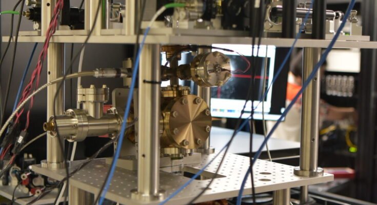 Image of a complicated set of wires, structural elements, and lenses.