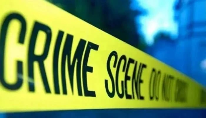 پولیس کا پیلا ٹیپ جرائم کے مقام پر آویزاں ہے۔ - رائٹرز/فائل
